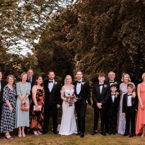 Wedding-group-photo-on-upper-lawn-at-Homme-House