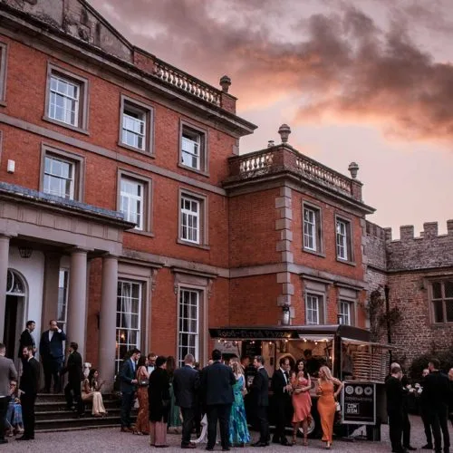 Wedding-guests-and-pizza-van-outside-Homme-House-in-the-evening