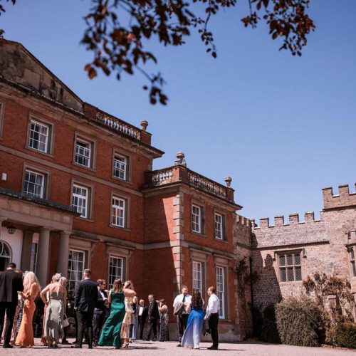 Wedding-guests-outside-Homme-House-in-the-sunshine